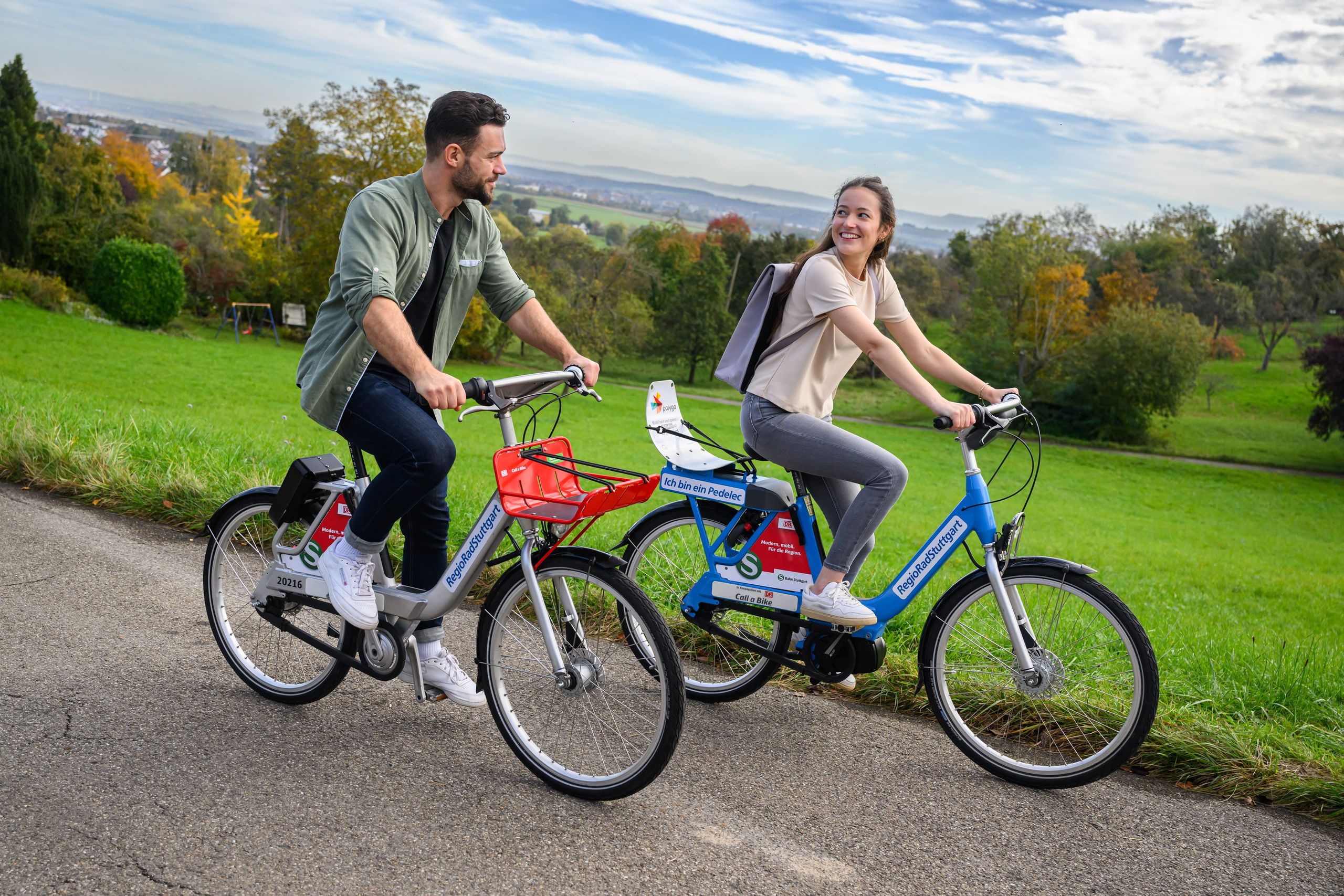 Two people riding on bikes